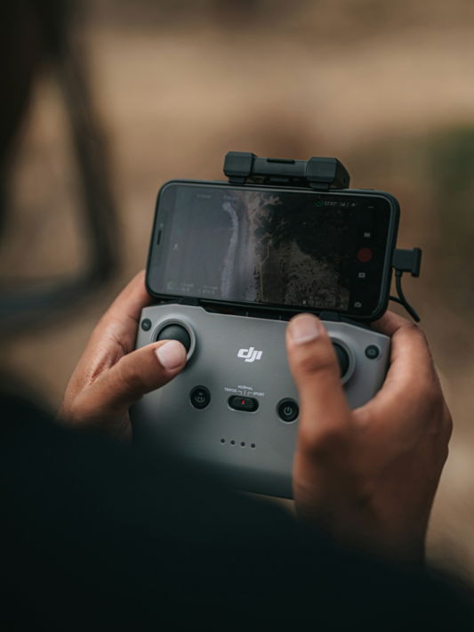 person holding black dslr camera